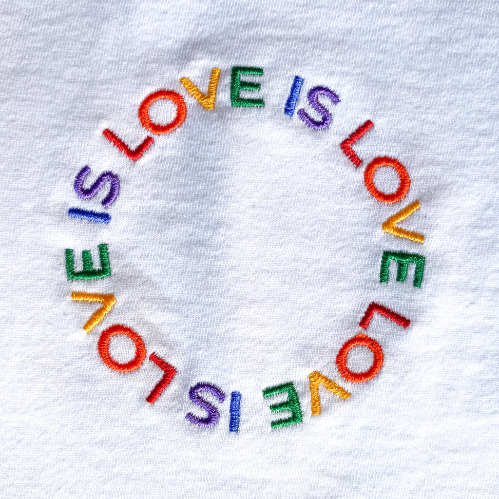 embroidered pride apparel with high quality stitching that says love is love 